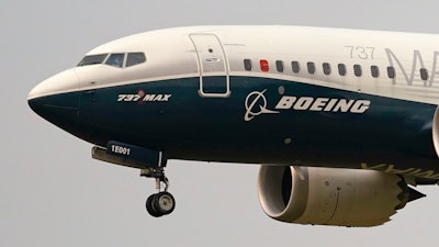 A Boeing 737 Max jet prepares to land at Boeing Field following a test flight in Seattle, Sept. 30, 2020.