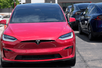 Unsold 2023 Model X sports-utility vehicles sit at a Tesla dealership, June 18, 2023, in Littleton, Colo.