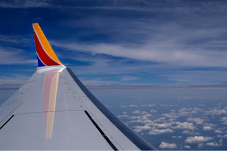 A Southwest Airlines Boeing 737 Max 8 passenger jet flies over the central United States heading for Chicago from Tulsa, Okla., June 15, 2024, in Tulsa.