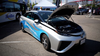 A 2021 Toyota Prius that runs on a hydrogen fuel cell sits on display at the Denver auto show.