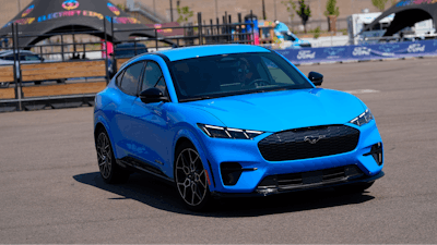 A motorist puts an electric 2024 Ford Mustang Mach-E through its paces on a test track at the Electrify Expo in The Yards Sunday, July 14, 2024, in north Denver.