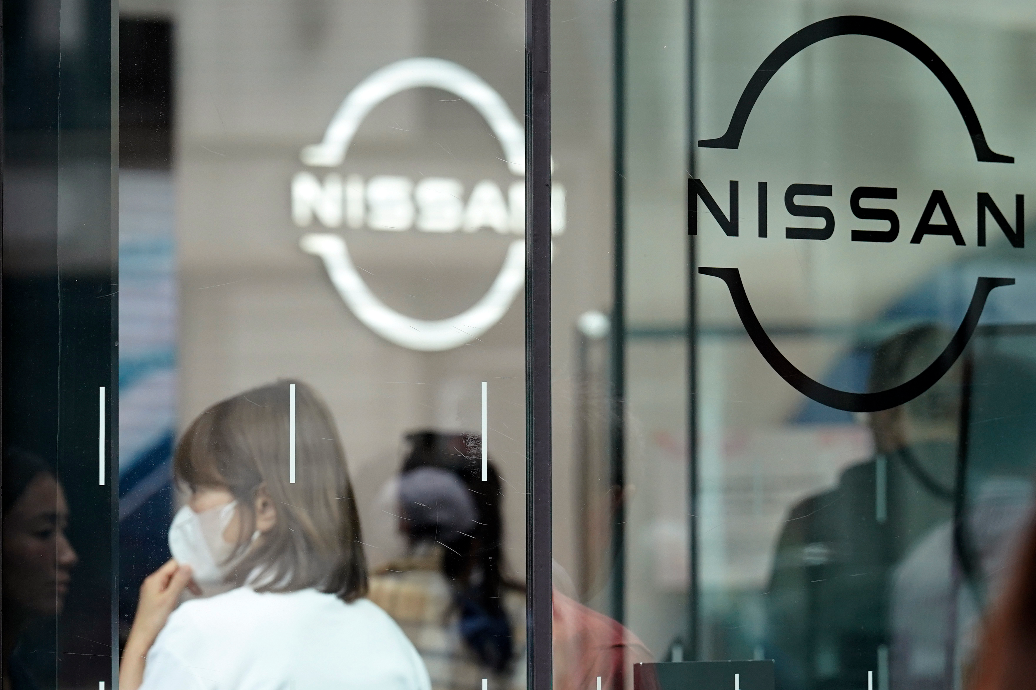 Logos at a Nissan showroom are seen in Ginza shopping district in Tokyo.