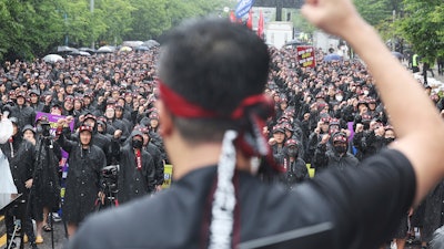 Members of the National Samsung Electronics Union shout slogans during a rally outside of Samsung Electronics' Hwaseong campus in Hwaseong, South Korea, Monday, July 8, 2024.
