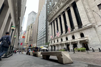 People pass the New York Stock Exchange on July 30, 2024 in New York.