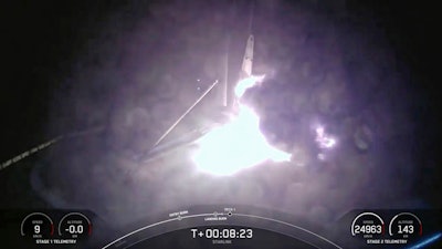 This image created from a SpaceX video, shows the moment when the SpaceX Falcon 9 rocket's first-stage fell over in flames after landing on an ocean platform offshore, Wednesday, Aug. 28, 2024, in the Atlantic Ocean.