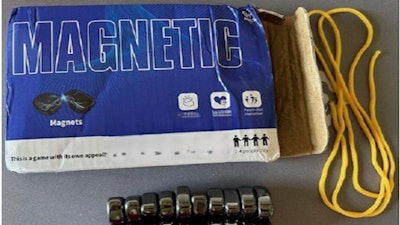 This photo provided by The U.S. Consumer Product and Safety Commission shows the front box of Magnetic Chess Game Sold by JOMO, that the U.S. Consumer Product and Safety Commission is warning consumers to immediately dispose of the magnetic game due to serious ingestion risks for children.