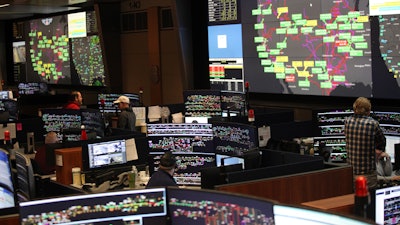 Union Pacific dispatchers keep track of trains moving across the western United States at the Harriman Dispatch Center in Omaha, Neb.