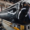 Northrop Grumman performs the insulation layup and composite case wind of its 2024 SMART Demo solid rocket motor case.