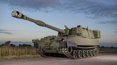 Green M109A7 Self-Propelled Howitzer on a gravel road.