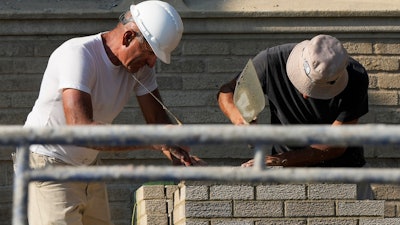 Construction workers at a residential building site in Chicago, Aug. 29, 2024.
