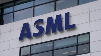 The logo of ASML, a leading maker of semiconductor production equipment, hangs on the head office in Veldhoven, Netherlands, on Jan. 30, 2023.