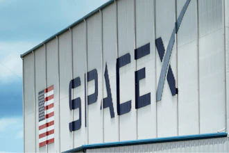 The SpaceX logo is displayed on a building, Tuesday, May 26, 2020, at the Kennedy Space Center in Cape Canaveral, Fla.