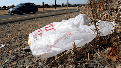 A plastic bag sits along a roadside in Sacramento, Calif., Oct. 25, 2013.