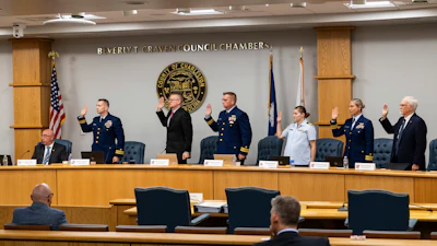 Coast Guard members of the investigative board for the Titan marine board formal hearing take an oath inside the Charleston County Council Chambers Monday, Sept. 16, 2024, in North Charleston, S.C.