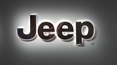 A Jeep logo is displayed at the North American International Auto Show in Detroit.