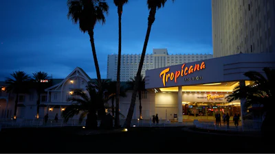 People walk outside of the Tropicana hotel-casino Thursday, March 28, 2024, in Las Vegas.