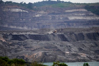 A dump truck carrying coal navigates its way near a coal mining pit in Sanga-Sanga, East Kalimantan, Indonesia, Dec. 20, 2022.