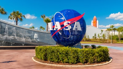 NASA Logo on Globe at Kennedy Space Center Visitor Complex in Cape Canaveral, Florida, USA.