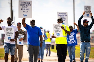 Longshoremen walk the picket line at the Barbours Cut Container Terminal during the first day of a dockworkers strike on Tuesday, Oct. 1, 2024, in Houston.