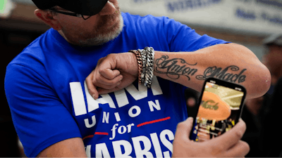Ed Lutgen shows off his tattoo while waiting to hear the results of the union vote on a new contract offer from Boeing, Monday, Nov. 4, 2024, at IAM District 751 Union Hall in Seattle.
