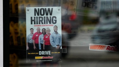 A hiring sign is displayed at a retail store in Buffalo Grove, Ill., Wednesday, Nov. 6, 2024.