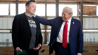 Tesla and SpaceX CEO Elon Musk, left, and Republican presidential nominee former President Donald Trump attend a campaign event at the Butler Farm Show on Oct. 5, 2024, in Butler, Pa.