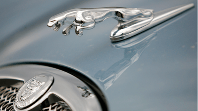 The hood ornament and a portion of the grill of a Jaguar automobile is shown at a dealership in Norwood, Mass. on March 26, 2008.