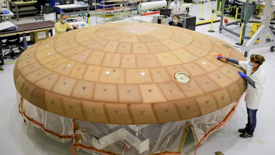 The Orion heat shield is covered in tiles made of a material that will burn up when exposed to extreme heat.