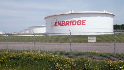 The corporate name stands out on tanks shown Friday, June 29, 2018 at at the Superior terminal of Enbridge Energy in Superior, Wis.