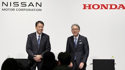 Nissan Chief Executive Makoto Uchida, left, and Honda President Toshihiro Mibe attend a joint news conference in Tokyo, Friday, March 15, 2024.