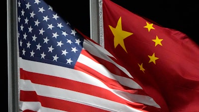 The American and Chinese flags wave at Genting Snow Park, Feb. 2, 2022, in Zhangjiakou, China.