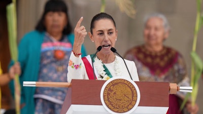 Newly-sworn in President Claudia Sheinbaum addresses supporters in the Zócalo, Mexico City's main square, on Oct. 1, 2024.