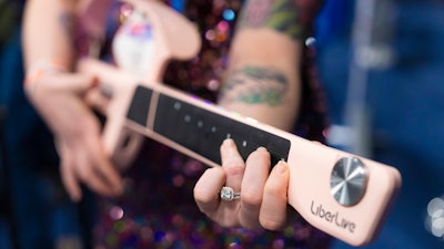 LiberLive showcases their stringless guitar at 2025 CES Unveiled, Sunday, Jan. 5, 2025, in Las Vegas.