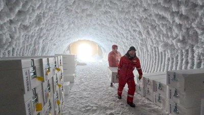 People walk through an ice core storage cave at Little Dome C field base on Tuesday, Jan. 7, 2025, in in eastern Antarctica.