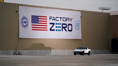 President Joe Biden test drives a Hummer at the General Motors Factory ZERO electric vehicle assembly plant during a tour, Nov. 17, 2021, in Detroit.