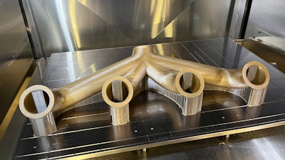 A part made from VICTREX AM200, demonstrating a typical aerospace or automotive part needing the high-performance characteristics of this material, such as high stress or high heat situations.