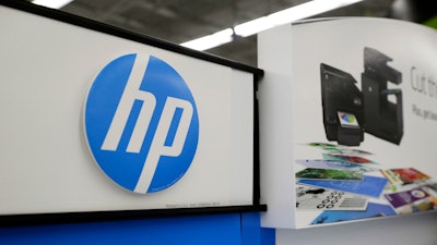In this Tuesday, May 24, 2016, photo, Hewlett-Packard products are on display at a store in North Andover, Mass.