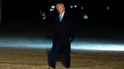 President Donald Trump waves as he walks from Marine One after arriving on the South Lawn of the White House, Wednesday, Feb. 19, 2025, in Washington.
