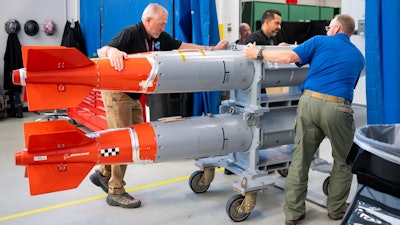 Two B61-12 joint test assembly units are prepared for shipping at the Weapon Modernization Lab at Sandia National Laboratories.