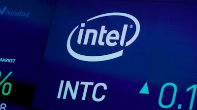 In this Oct. 1, 2019, file photo the symbol for Intel appears on a screen at the Nasdaq MarketSite, in New York.