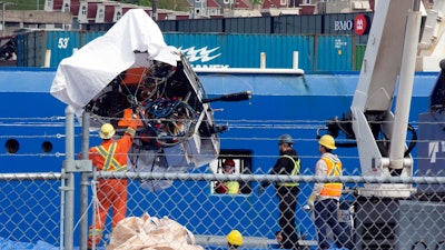 Debris from the Titan submersible, recovered from the ocean floor near the wreck of the Titanic, is unloaded from the ship Horizon Arctic at the Canadian Coast Guard pier in St. John's, Newfoundland, Wednesday, June 28, 2023.