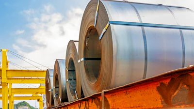 Steel coil on a trailer at a port.