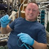 NASA astronaut Barry Wilmore holds a 3D-printed wrench made aboard the International Space Station.