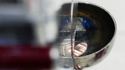 A souvenir penny falls out of a penny press machine at the American Dream mall, Sunday, March 2, 2025, in East Rutherford, N.J.