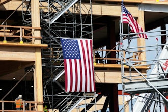 A construction crew works at a site in San Bruno, Calif., March 12, 2025.