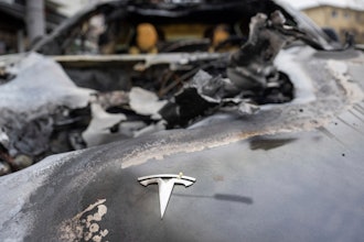 A burnt-out Tesla car stands in the Steglitz district of Berlin, Friday, March 14, 2025, as four Teslas are suspected to have been set on fire in Berlin last night.