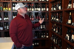 Craig Ledbetter of Vino Farms looks at locally made wines at the Lodi Wine Visitor Center, Lodi, Calif., March 18, 2025.