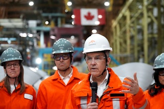 Canadian Prime Minister designate Mark Carney, second right, speaks to steel workers after touring the ArcelorMittal Dofasco steel plant in Hamilton, Ont., on Wednesday, March 12, 2025.