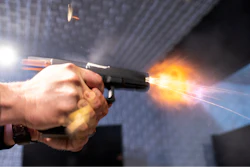 A semi-automatic pistol with a conversion device installed making it fully automatic is fired as four empty shell casings fly out of the weapon, at the Bureau of Alcohol, Tobacco, Firearms and Explosives (ATF), National Services Center, Thursday, March 2, 2023, in Martinsburg, W.Va.