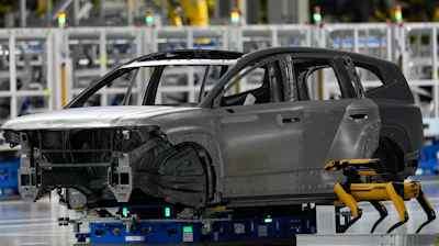 A Boston Dynamics robot works on the line during a media tour at the Hyundai Motor Group Metaplant America, Wednesday, March 26, 2025, in Ellabell, Ga.